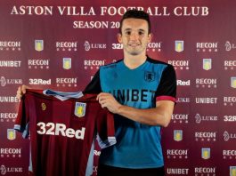 John McGinn signs for Aston Villa and holds up shirt