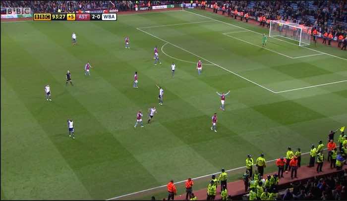 aston villa fans run on the pitch
